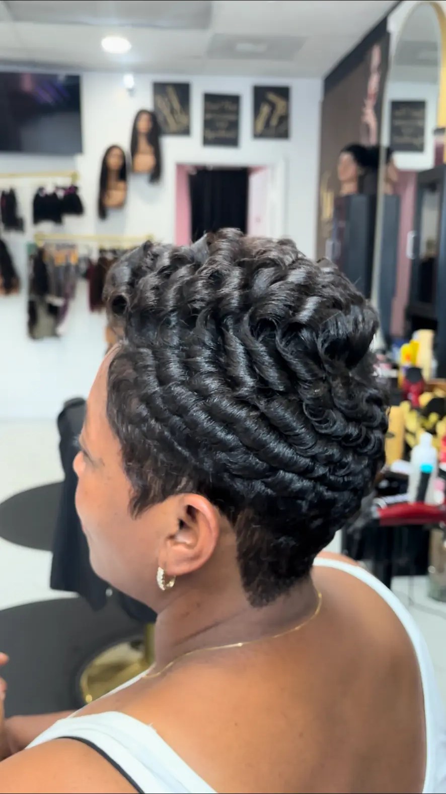 Sculpted pin-curl short cut with deep waves by Carmie Hair